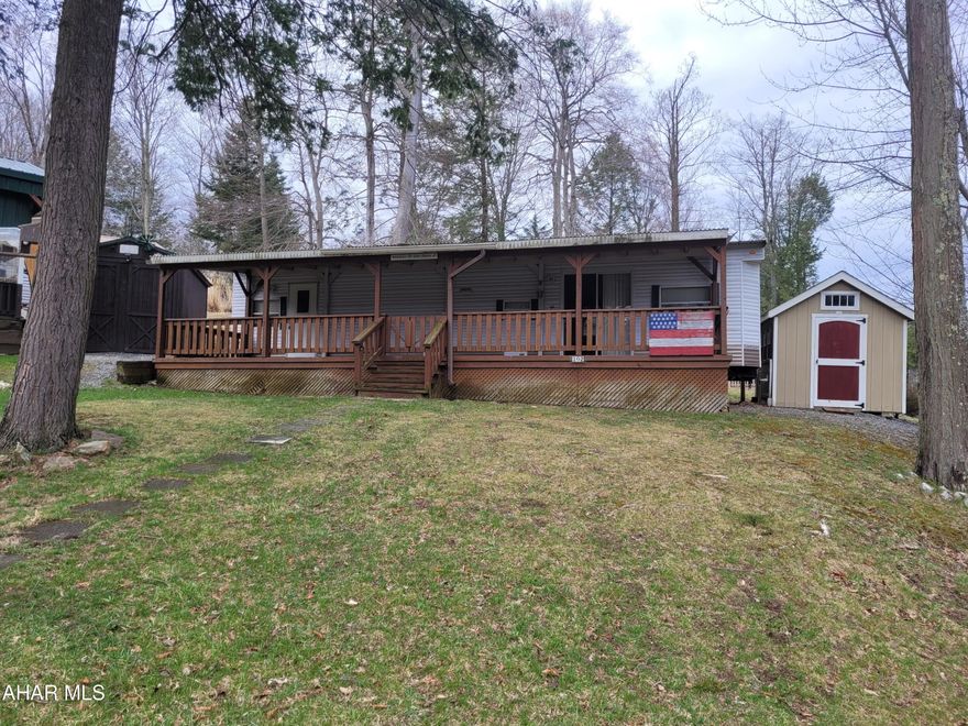 Well maintained and spacious.  This two bedroom unit offers ample sleeping room.  When the extra bed in the bunk room is not in use, it can be converted into an extra table.  Sleeper sofa like new.  This deck is built for entertaining.  
A second adjacent lot is included.  You can use it for extra parking or for a second camper.
Slide outs are covered so they are protected from the weather.