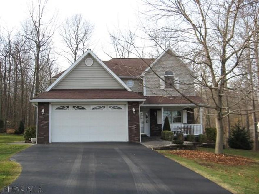 This adorable home is nestled on a wooded corner lot in desirable Ridgewood Heights Development.  It has loads of character and comfort features like the open concept kitchen/breakfast area to living room with fireplace and built-ins.  Just off the breakfast area you'll find a wonderful deck with a unique built-in Gazebo overlooking the expansive yard and wooded areas.  A must see home!  Plus - Adjoining lot for sale can be purchased to give you even more space.