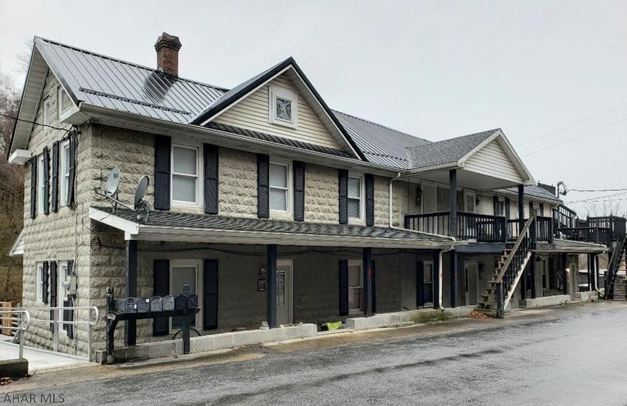 Great Opportunity!  Live in one unit and rent the rest.  This includes an adjoining 3-bedroom home plus 5-unit apartment building (4 are 1-bedroom units & 1 is an efficiency unit).  Has separate heat & electric.  Landlord pays water, sewer & garbage.  Good Income producing property with 2.89 Acres.  House has Oil heat; apartments have electric heat.  Seller has a real estate license.  J-498