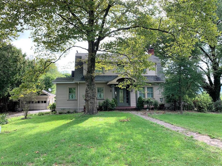 Stately 1920's era Dutch Colonial home resting on the outskirts of the Downtown Bedford area. Main level features an entry foyer w/ open staircase, living room w/ hardwood floors & fireplace, kitchen offering granite counters, s.s. appliances, & tiled backsplash, dining room w/ built-ins and glass french doors, family room w/ bar, den with surrounding windows, full bath, and a mud room. Second level offers a owner's suite with ensuite bath and closet, two additional bedrooms and a full bath w/ clawfoot tub. Guest cottage that would make a perfect Airbnb, in-ground pool, flagstone walks & patios, & lily pond. Oil HW heat, heat pump & central air. Full walk-out basement and a detached one-car garage. Convenient location close to all amenities but rests on a large 1.54 acre lot. Ready to go!!