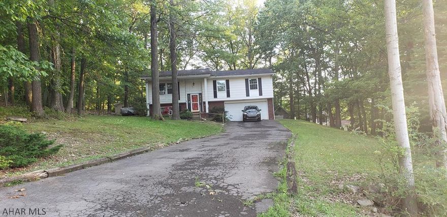 Great potential! 3 bedroom 3 bath bi-level in the Bell Meade section of Altoona. This home has had many updates including a remodeled kitchen, partial basement finish with plumbing for a bathroom. The great covered deck outback is perfect for entertaining and grilling. The wooded lot has a great private feel but close to town. With some finishing touches this house can be your home. Call listing agent for more information and your private tour. Offer may be subject to court approval.