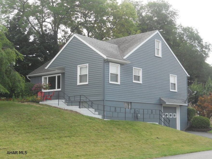 Located on one of the most charming streets in the Hollidaysburg Borough, this home is a must see!  The move-in ready, corner lot house is accompanied by a newly renovated second floor with recessed lighting, new carpet and completely remodeled kitchen and bathroom with black granite flooring.  Hardwood floors throughout bedrooms and living room, custom wall painting, modern style and taste.   Central air, modern bath, new Corrian kitchen counter tops are among the many tasteful amenities of this in-town home.  Located just blocks from all levels of Hollidaysburg Area School District buildings and central location to Altoona.