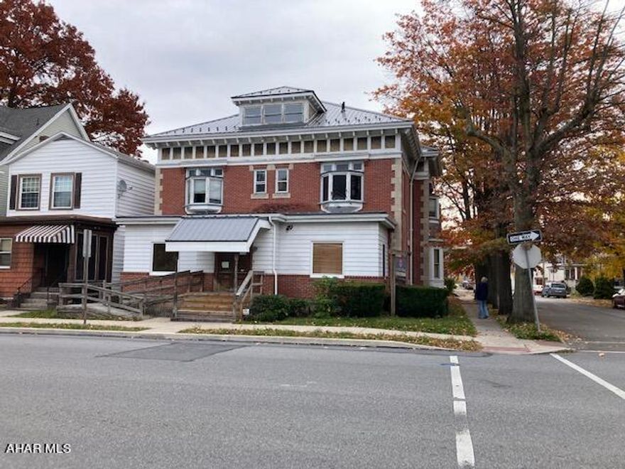 Office on first floor with half bath and kitchenette.  2075 sq. ft.  Beautiful woodwork and pocket doors.  Hardwood and carpeting.
Apartments on second and third floors