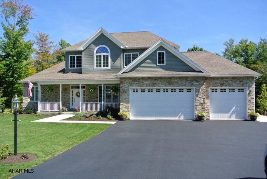 Custom quality built home. Better than new! Features include a 1st floor owners en-suite, gorgeous great room w/vaulted ceiling & floor to ceiling stone FP. The kitchen is a cooks dream...double ovens, center island, breakfast area & tons of storage..all SS appliances stay. Finished lower level has its own full kitchen, family room and more storage. Enjoy morning coffee on the covered composite deck. 3/4 acre lot. Really, Really nice!!