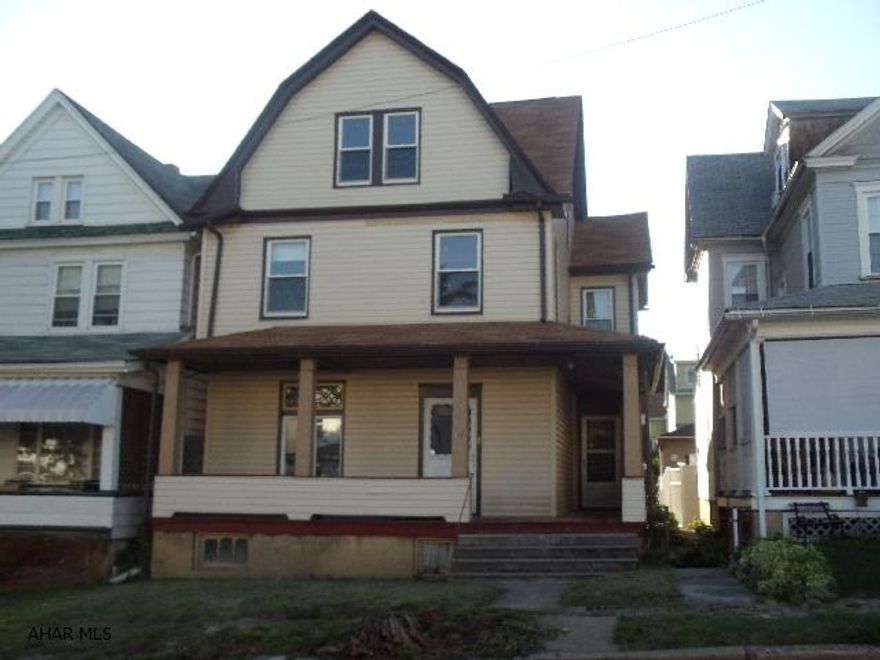 Large rooms, enclosed back porch, 5 bedrooms (including 2 in attic), original woodwork, 2 sets of pocket doors, wrap around porch, 1-car detached garage, newer roof,electrical breakers, furnace, hotwater heater, vinyl windows, & siding.   #J-139