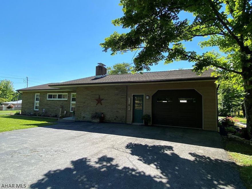 The perfect country ranch only 3 miles from town! Renovated and ready for you. Home has 3 bedrooms and 1.5 baths all on the main floor. Hardwoods and brand new ceramic tile throughout. Kitchen features open concept to dining room and living area. Brand new deck and porch for outdoor entertaining. Partial finished basement could be rec room or additional living space. Brand new furnace used as secondary heat source, home features an outdoor wood furnace that also heats outbuilding. 40x60 insulated work building with 10 foot overhead doors. Work area has radiant heat and half bath. Two full tanks of oil and a years worth of wood will convey. All of this on just under an acre of flat, usable land. Schedule your showing now!