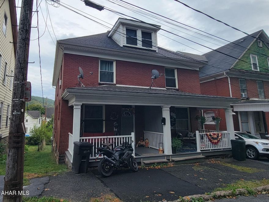 2 1/2 story, brick double house with 3 bedrooms on each side. Front and rear porches. Separate utilities. Owner pays water, sewer and trash for 1016 unit.