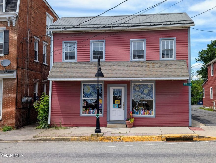 Investment opportunity!  Downtown Bedford store front in the commercial district.  Make the most of your real estate space with this 5 unit mixed use building ( 1 store front, 4 apartments) and 3 car garage, all being leased to tenants.  Coin Laundry. Complete with off street parking for tenants.  Turn key rental!  Walking distance to river, shops, restaurants, and all the downtown amenities.