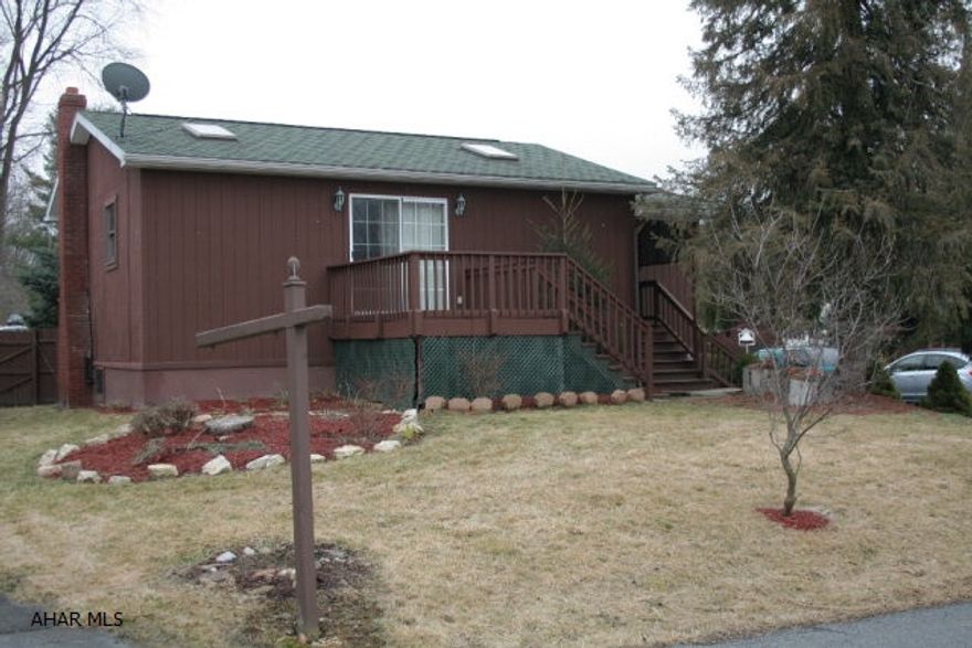 Open concept home with one full bedroom, an office or possible second bedroom and full bath. Galley kitchen with open dining room/living room. Several skylights throughout provide soft, natural lighting. Enclosed front porch and a nice deck off of living room for outdoor entertaining. Basement has laundry facilities, 1/4 bath and several open rooms for additional living space. Plenty of storage as well. Would make a nice rental property.