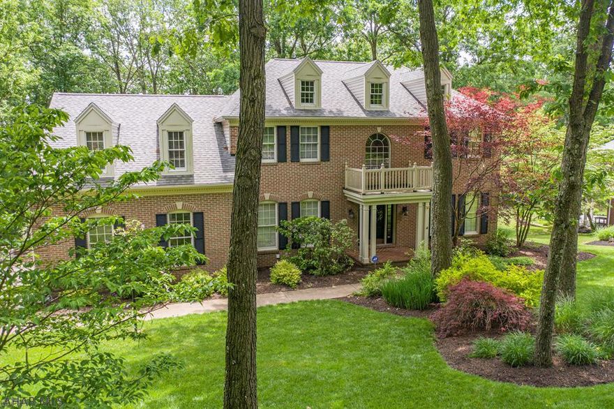 Impressive 2-story with uncompromising quality located in a very private and quiet wooded location features 4/5 large bedrooms.  Many meticulous details.  Lots of HWF and granite.  This is a 'one of a kind' home.  So many upgrades!  An open 2-tier maintenance free composite deck is great for entertaining.  Finished basement with rec room.  Grand foyer opens to a home office and sets the stage for the main floor with formal LR and DR.  Kitchen is 'to die for' and a 'chef's dream'  Step down Great Room has FP and vaulted ceiling W skylights.  MBR with Trey ceilings extends into a lovely bath with large double WICs and Jacuzzi tub. Wait till you see the luxurious guest room with gas fireplace.   Finished lower level leads to an open paver patio.  Quality craftsmanship from top to bottom.