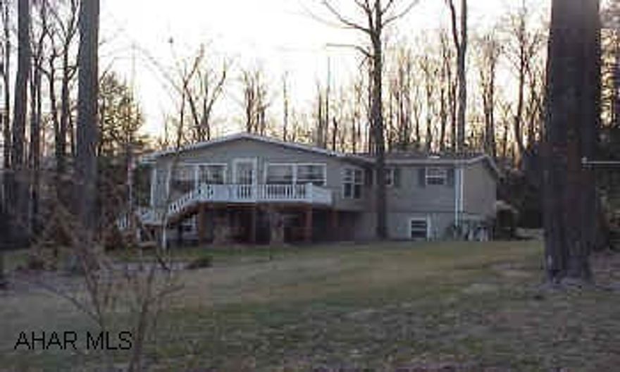 Great manufactured home with addition. 3 brs. 2 bths, fireplace, whirlpool tub, central air, large landscaped corner lot. Shed. Basement partially finished.