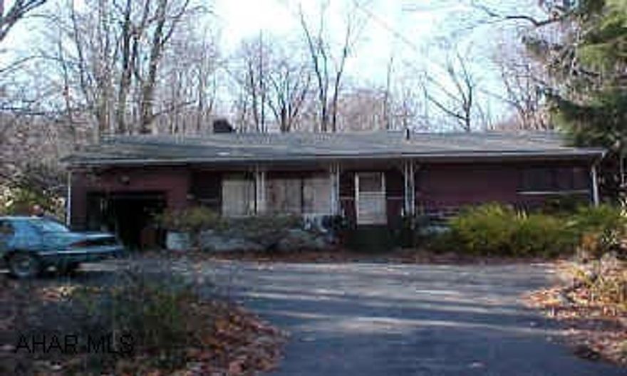 Near Altoona Gun and Rifle Club.  See agent for list of excluded buyers for commission. Country Living!  Nice 2br in Sinking Valley on 1.3 Acres.  Features a dual fireplace and mature trees.