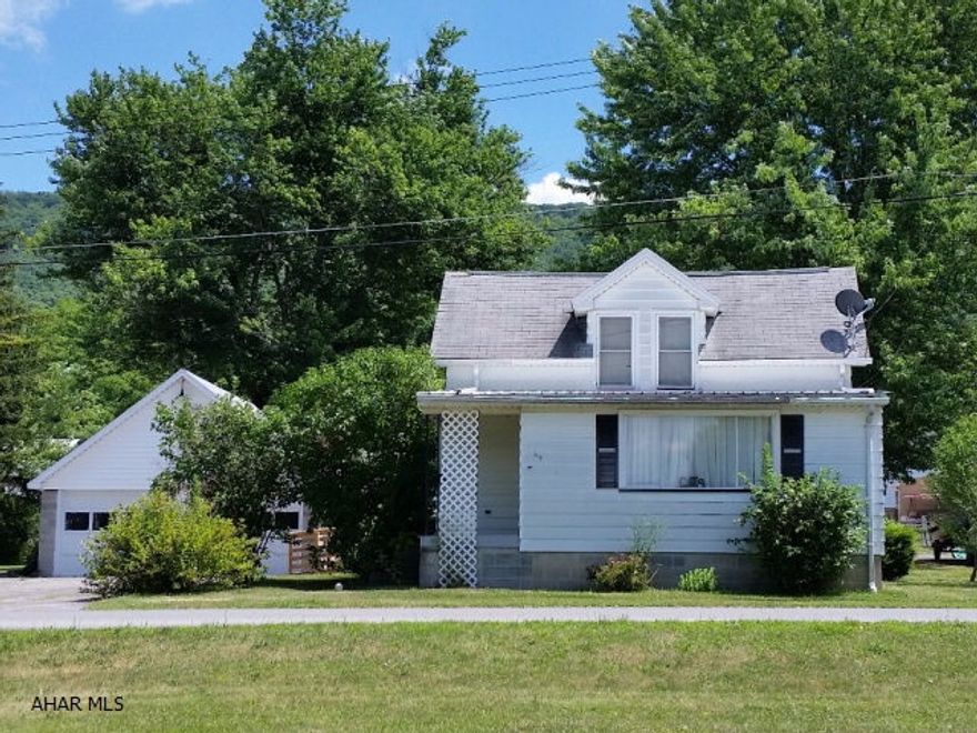 Aluminum-sided home with updated kitchen and bath, block 2 car garage, nice covered back patio, 1st floor laundry. 115 x 160 yard. Oil forced air heat plus propane wall heater. Breakers.   J-346