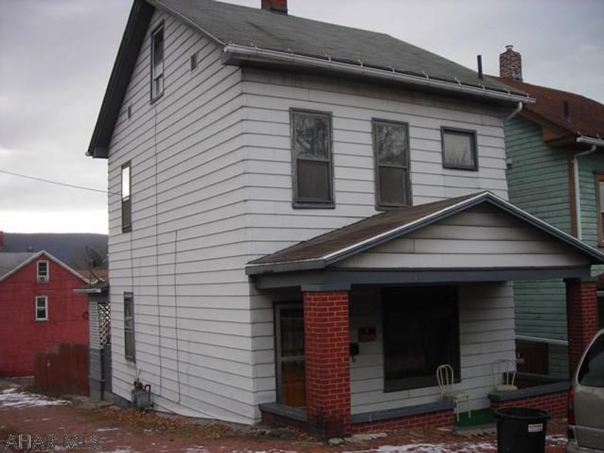 Nice, solid, aluminum sided home.  Would make a good starter or a great investment.  Sits on a corner lot with covered rear porch and fenced lot.  Priced to sell quickly.  You should really take a look!  Taxes are estimated and sq footage from deed book should be verified by buyer.