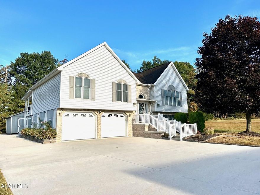 This lovely custom built home with an extra lot adds a nice side yard for gardening etc. The kitchen with its oak cabinetry is accented with additional counter space provided by the Island with recess lighting. The open dining and living room is spacious offering a cathedral ceiling and a patio door to the back deck area.  The large master suite has wall size closets and provides access through the patio door to the back deck. Master bath with tub and shower. The main bath provides a skylight for natural light, double sink and tub and shower. The family room has a gas fireplace and 1/2 bath and enclosed laundry area with washer/dryer. All Underground utilities. Gas propane heater in the garage, over sized garage with solid wood cabinetry for additional storage/workshop. Insulated with electric 2x6 shed for more storage. Next to the garage is a hook up for your RV. The backyard features a small seasonal stream that flows in the Juniata river.