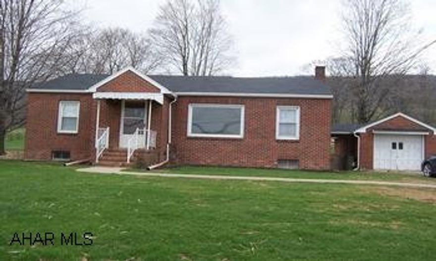 cute 3 bedroom brick ranch rear Raystown Lake.  From Martinsburg, go over Fredricksburg Mtn, turn left onto Rt 26. Home is on the left before Marklesburg.