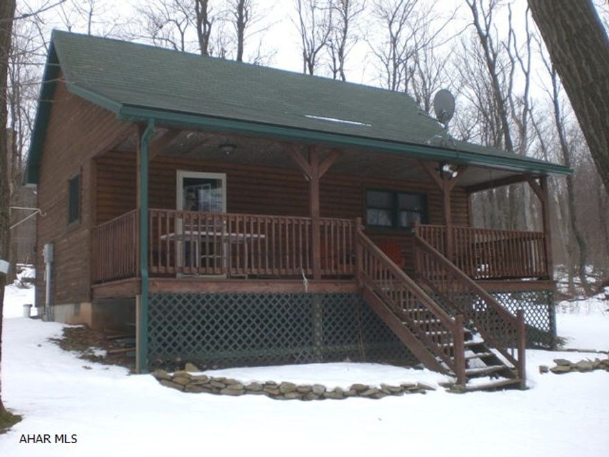 Charming log cabin on over 7 acres. Cathedral ceiling, knotty pine walls, maple cabinets & 200 amp electric. Electric & propane heat, private well & private sewer, large covered front porch & back deck. Close to Shawnee State Park, Indian Lake, State Game Lands, Flight 93 Memorial. Great hunting area, hiking or retreat property!