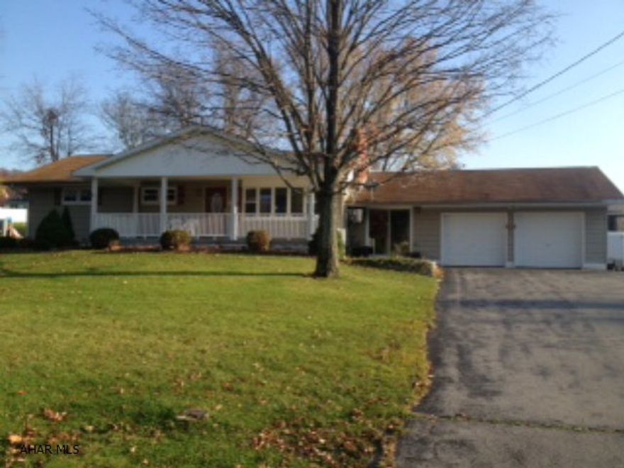 Freshly painted Ranch with breezeway and attached 2 car garage.  Natural gas available - (3) - 275 gal oil tanks - full & propane for heater on enclosed rear porch.  Beautiful oak kitchen with built-in hutch, new carpet, woodburning fireplace in living room, large covered front porch.  Priced to sell.  Detached 2 car garage with bonus room, detached motor home - garage and shed.  Woodburner in breezeway, new garage doors, hardwood under carpet.