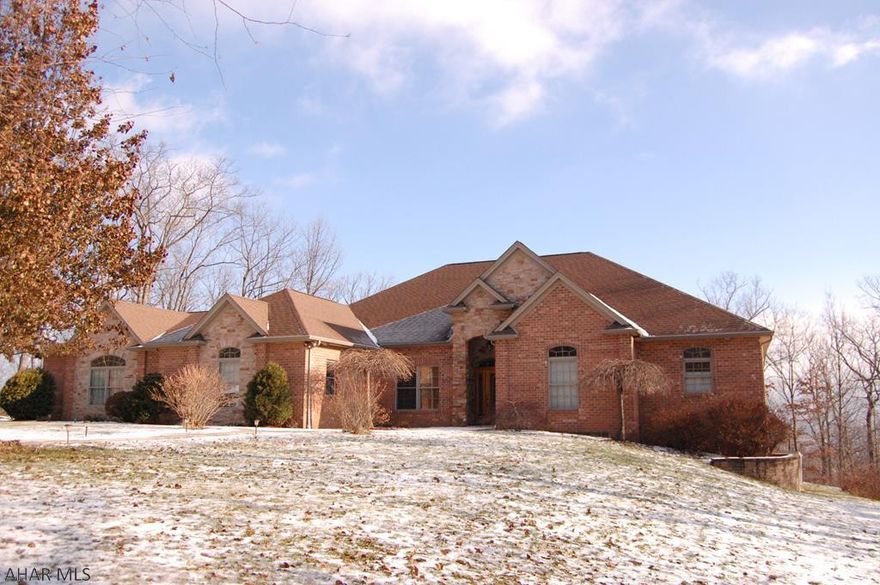 Beverly Hills Spectacular!  This home offers limitless possibilities. Situated on a 2 acre lot in a desirable area of Altoona, conveniently located minutes from Penn State Altoona and UPMC. This home boasts 5 bedrooms, 5 bathrooms, hot water radiant heating system along with central vac. The kitchen is highlighted with an open concept, featuring granite counter-tops, a breakfast bar, and cherry cabinets.  The kitchen opens to a large great room with vaulted ceilings, wall of picture windows for natural light and a custom stone gas fireplace.  Each of the 4 bedrooms on the main level have their own full bath along with a 1/2 bath off the formal dining room.  Large finished living space in the lower level along with over 1000 sq ft of storage. Too many amenities to list. Click on 3D tour!!