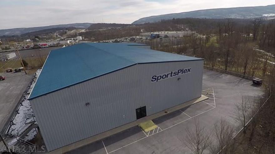 Operating Multi function sports facility. Located in the high traffic area next to Walmart on Route 30, this warehouse is a solid investment. While it is currently used as a sports complex, the open floor plan allows for unlimited possibilities. With a ceiling height of 30 ft inside a fully insulated metal exterior, not to mention 21,525 total sqft, if you are contemplating opening your own or relocating your business, then this is a MUST SEE! Note that the taxes have been reduced with an assessment appeal. Property cost over $1 million to build!