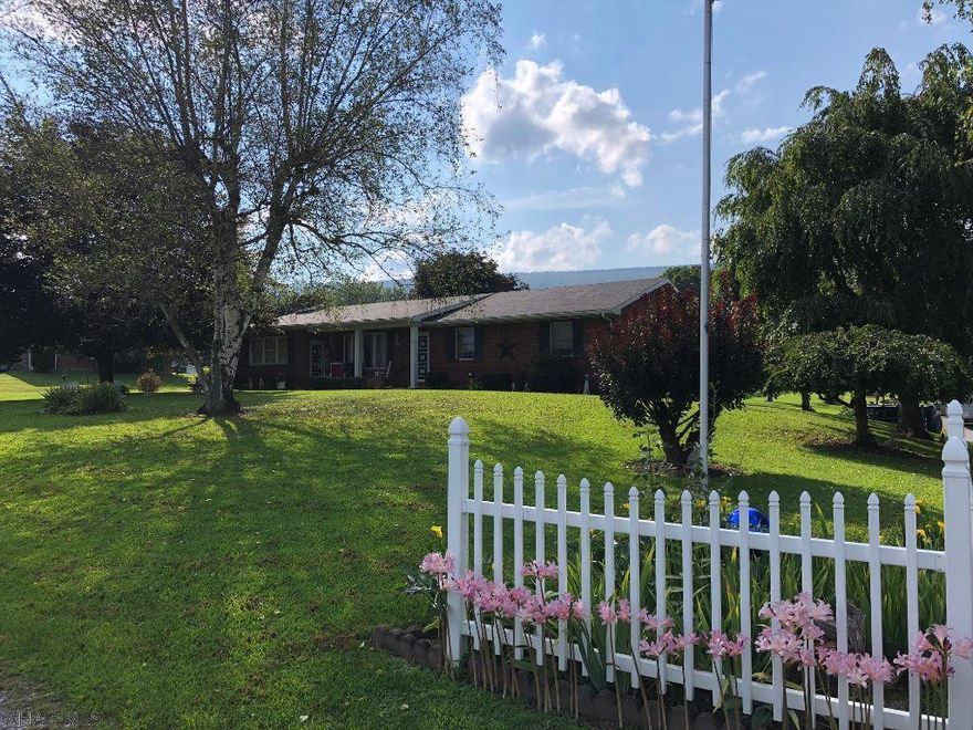 Well maintained, spacious brick ranch. 3 bedrooms, 1 1/2 bath. Central air, 200 amp electric. 2 car integral garage and 2 car detached garage. Spacious family room with beautiful fireplace. Finished basement complete with kitchen and laundry room. Relaxing rear deck, cute outbuilding for storage, lovely landscaping. Just waiting for you to move in!