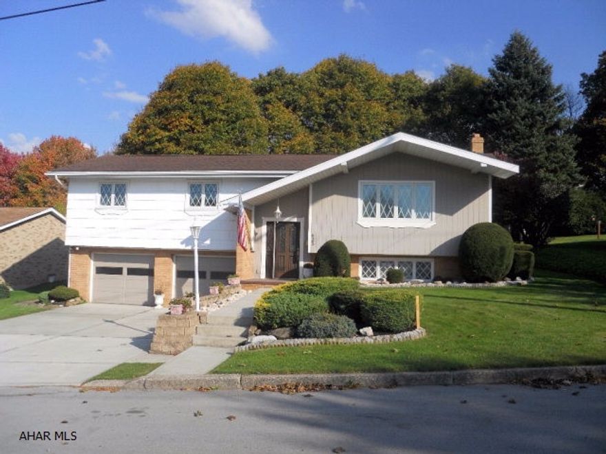 Here is an opportunity to own a well-kept, single family, one-owner home in Portage.  This 3 bedroom, 2 bath, home has had many upgrades by the former owner.  Home includes 2 full kitchens with all appliances.  Beautiful large family room with brick accented wood burner and bar with cabinets galore.  Plenty of storage throughout this home.  Large, deep closets - even in the over-sized, 2-car garage.  Located near all of the schools in this quiet neighborhood, this home is a place to come to and relax.  Large gas grill on outside patio overlooks meticulously landscaped yard. Built with all plaster walls, this home has new thermo-pane windows throughout with a remaining 46-year warranty.  Schedule your personal showing to see this fantastic home.