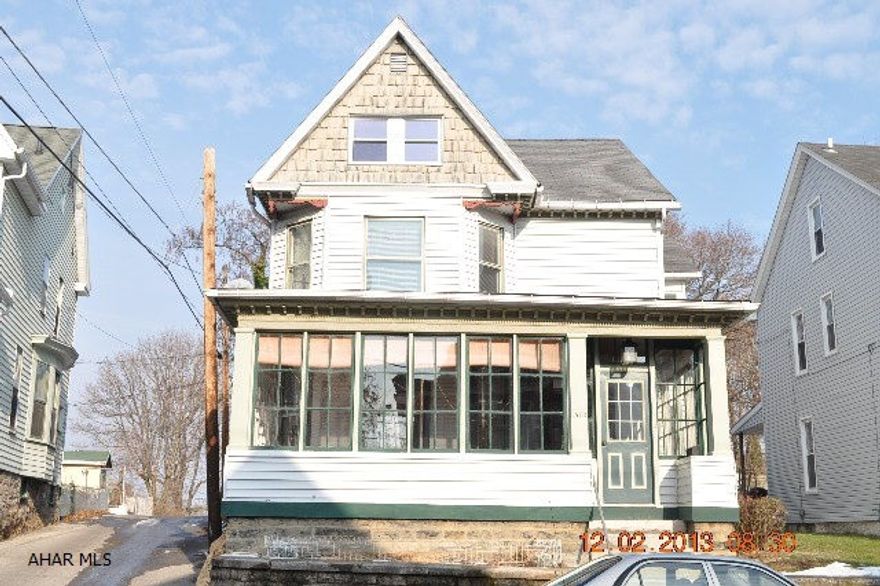 2.5 story is a move in ready. The home Features a large closed in sun porch that leads to grand entrance foyer. Beautifully finished hardwood floors through out the home,the kitchen is up dated, counter tops and ceramic back splash, oak cabinets built-in dishwasher and microwave. 2nd floor master features a walk in close. All the bedrooms are good size. there is off street parking.