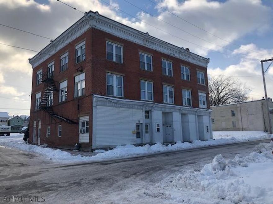 11 unit apartment building with 7 units occupied and 4 units that need finished. Building has lot in back for parking and additional vacant lot next door. Rubber roof, thermopane windows and new furnace.4 total lots convey with property.Please allow 48 hours for showing requests.