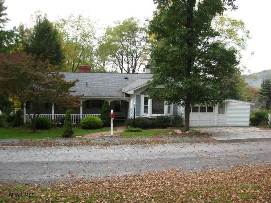 Nestled at the end of a quiet street, this four bedroom, two bath home has lots to offer - Newer windows, roof and furnace, mature landscaping, large covered front porch, two kitchens, quality wool rugs, two laundry areas, shed, rear deck & sunroom overlooking a lovely back yard and more!  Located within walking distance to schools and downtown Bedford.  This is an excellent value.