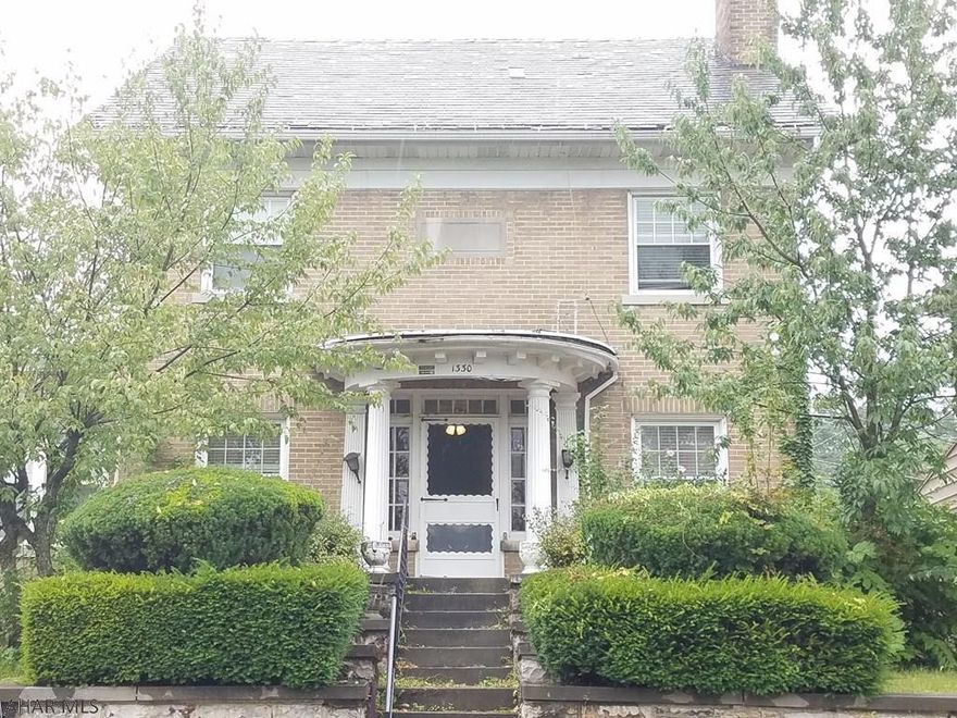 Take a step back in time with this Stately Manor on top of the hill. This home features many original charming features with some modern updates.  With 4 bedrooms and 2.5 Bathrooms, this home could easily accommodate your growing family. There is a beautiful fireplace in the main living room that makes for a great focal point, along with the gorgeous hardwood floors and beveled glass french doors.  All of the bedrooms are large with hardwood throughout, and there's an abundance of storage space.  With almost 4,000 total square feet, you will never run out of space!  There is also a large 2 car garage perfect for off-street parking.