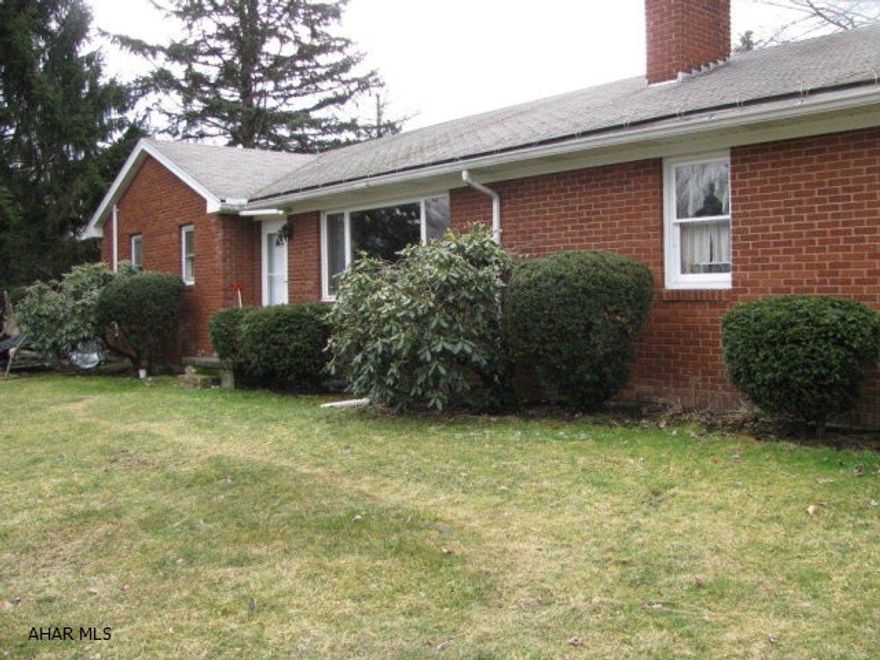 Charming Tyrone brick rancher on 1/2 acre next to Reservoir Park! LR. w/ HWF and wood burning fireplace, DR. w/HWF and 2 built in cupboards, 3 BR., tiled full bath, sunroom w/ceramic tile, spacious family room, 2 car garage and shed!