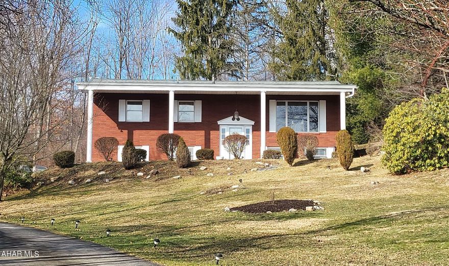 Meticulously kept home with fantastic curb appeal!  This all brick 3-4 bedroom, 2 bath home is exquisite! Oak cabinets in the large kitchen top a custom tile floor and features a pantry, glass front cabinet set.  The dining area opens to a large patio that is partially covered and enclosed.  It overlooks the back yard frequented by deer and other wildlife. The spacious living room boasts floor to ceiling windows that present amazing views of Altoona.  The bedrooms are large, each with closet space!  Custom, heated tile and a jetted tub stand out in the main bathroom in addition to the convenient linen closet and large vanity.  The lower level offers a possible 4th bedroom, a nice sized family room, laundry, 3/4 bath with heated tile floors and an abundance of storage.  The garage is 2 cars deep or utilize the space as a great workshop area because there is plenty of parking on the paved driveway lined in lights!  This home offers so much privacy on the dead end cul-de-sac and the views are beautiful!  All of this on 2.23 acres!