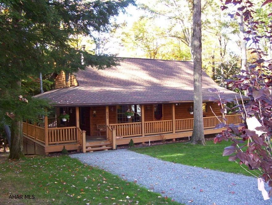 Beautiful Log home with wrap-around covered deck, nice open floor plan, vaulted knotty pine ceiling, Harmon coal burner + electric baseboard heat, finished basement w/spacious family room, 3-car finished garage w/ epoxyed floor, partially wooded lot.  Glendale Yearound gated community with outdoor heated pool.  (2 miles to Glendale Lake fishing & boating).  (Dues to $401/yr includes use of pool, trash, & road maintenance).  #J-047