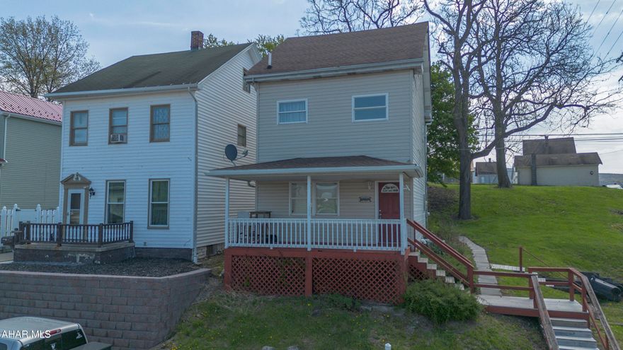 This two-story home sits on a substantial corner lot that offers plenty of outdoor space. The main level contains the living room and an eat in  kitchen that houses the laundry area for convenience. Moving upstairs, the second floor holds two large bedrooms and a full bathroom. The third bedroom is located in the finished, heated attic, providing a private retreat at the top of the house. This floor plan maximizes the footprint . Schedule a tour.