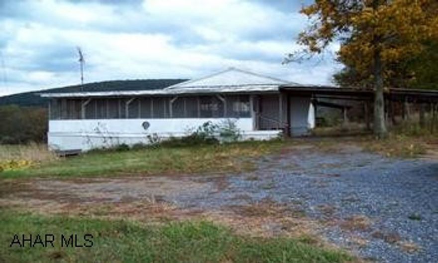 Rt 30 East thru Breezewood. One mile past Breezewood, left onto Mtn Chapel Rd. Go 5 miles. Property on left. Sign in yard. Three trailers combined to make a 1 story house.  Large rooms, open floor plan. Spacious yard.