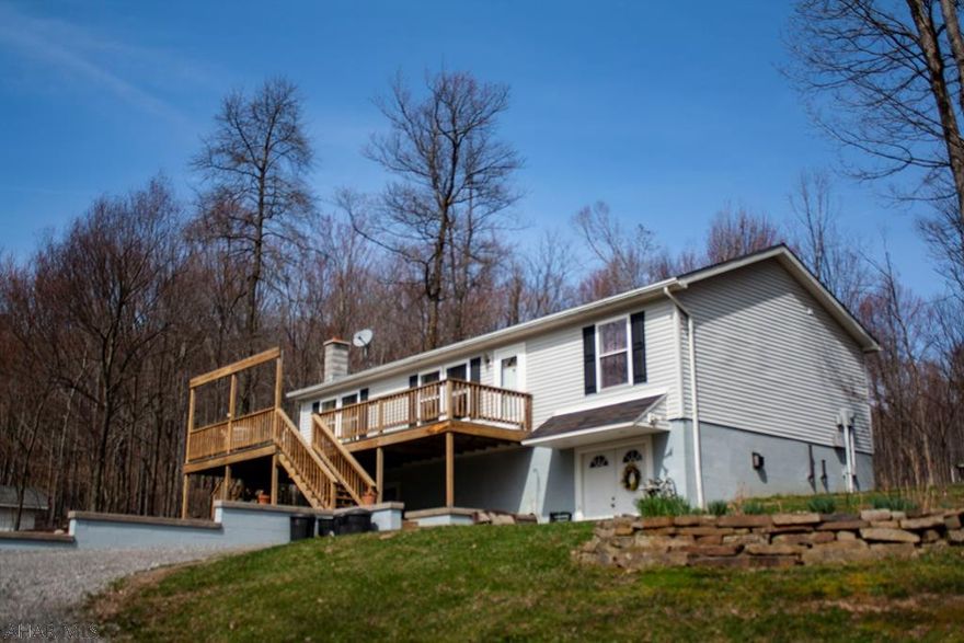 Raised ranch on almost 7.5 acres. Privacy yet close to town. Multiple fuel sources including a nearly new outside furnace to keep your utilities low! Multiple outbuildings for storage.  3 bedrooms and 3 bathrooms with all appliances included.  Full basement with entertainment area with walkout.  Enjoy privacy yet proximity to town