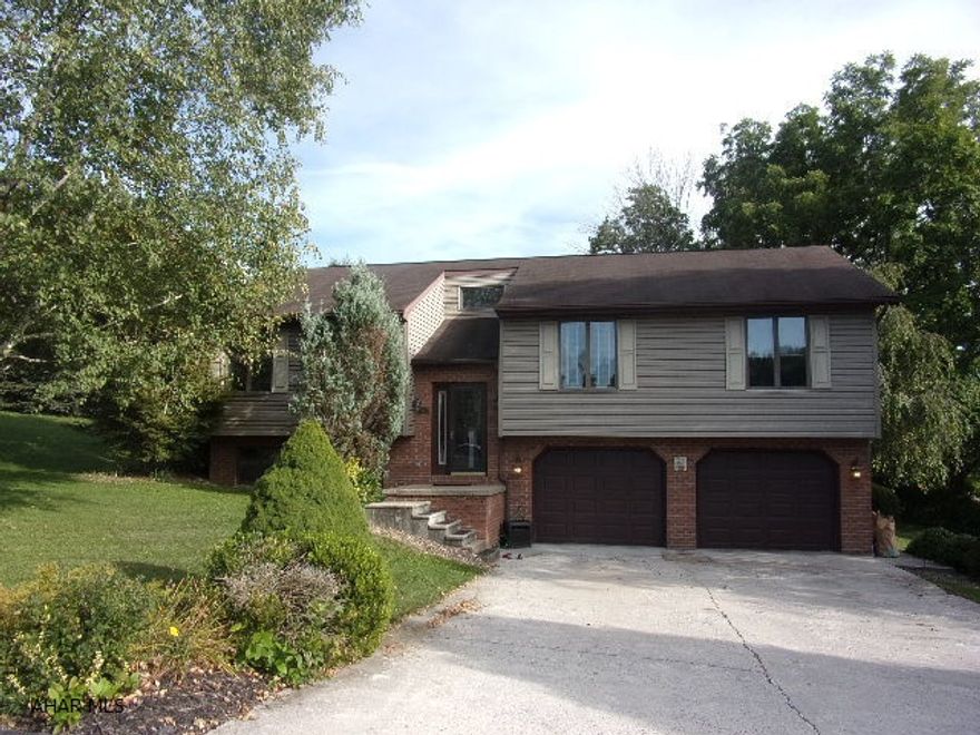 A rare find! Charming bilevel on corner lot in Bellwood Antis School District.  Great open concept first floor with vaulted ceilings and skylight in main bath.  3/4 master bath has been redone with tile shower, granite sink and tile floor.  Brazilian cherry floor in bedroom.  Lots of entertaining room in the lower level family room with a brick gas fireplace, and a wet bar with fridge and stools included!  Relax on the rear deck overlooking a .295 acre lawn.