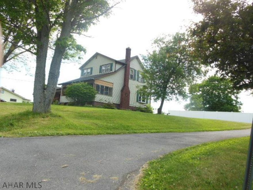 Reduced Home!!  Beautiful rural location for this 2 story home on a nice 100X150 lot, with nice views between Altoona and Bellwood. OFA w/central air, 1.5 car attached garage with a covered carport/breezeway close to kitchen for groceries, rear covered patio and more. 3-4 BR (4th in basement). 1.75 BA, needs light TLC. Not able to accept FHA or VA without some work. Priced to sell, and very comfortable setting away from the city life, good space from the neighbors... Close to Pinecroft Estates and Belair Estates, but better taxes here.....Heat approximately $100./month (3) tanks to take advantage of good prices.  Well water / Sewage $50./month.  Can be a super comfortable, homey home!!  Owner open to offers...