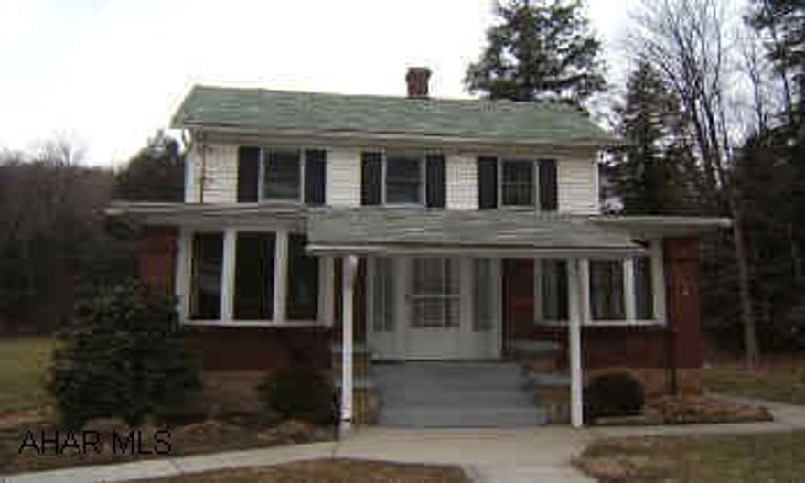 Cozy two bedroom home on 6.2 acres.  Oversized two car garage with mechanics pit.