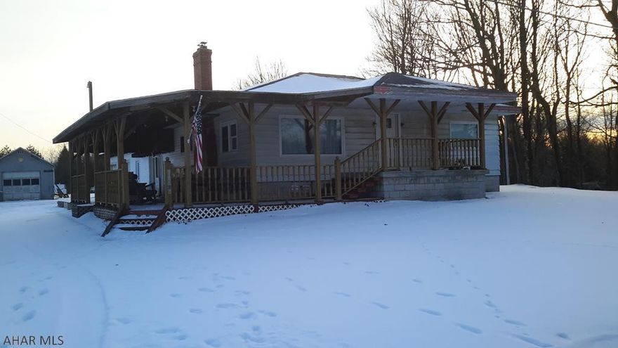 Quiet country setting for this 3 bedroom 2 bath home.Large wrap around covered deck, large 2 car attached garage. Fruit trees,blueberry bushes and grape arbor are part of this landscape.Close to Blue Knob Ski Resort & State Park. All season living to enjoy on 1.13 acres. Home boasts multiple heat sources for cozy winter nights. Well equipped eat in kitchen or sit next to fireplace in the living room. Retire to one of the 3 nice sized bedrooms. Call to make this your next home! Priced to sell!