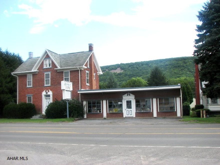 Spacious 2.5 story home & commercial store front. Currently Local floral shop and home.  Also, has 2 car garage & storage buildings. So Much to offer and a great location at an excellent price.