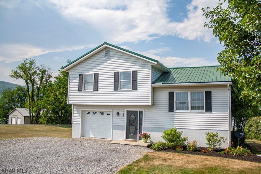 Move in ready home on over half an acre. Come make this 3 bedroom and 1 bathroom home yours today. Plenty of storage throughout. Enjoy entertaining and the beautiful views from the raised deck off kitchen or the concrete pad underneath. Well landscaped flower beds surround this charming house.