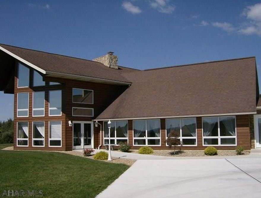 Portage Twp-One of a kind! Beautiful energy efficient 4 BR, 3 1/2 bath log sided, stone & glass home on 1.8 acres. There is a large 2 story Great Room with a fantastic view through the glass wall. Huge kitchen/ dining area with granite counters, Oak cabinets, fireplace & breakfast bar. Master BR suite with vaulted ceiling, stone fireplace & private balcony. Master bath with jetted tub, shower & walk-in closet. 4 car garage with office area & stone fireplace. (2)200 amp electrical service. Many extras.