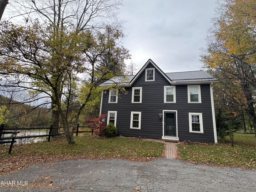 Welcome to this charming, completely remodeled Colonial style home with new windows that come with a life time warranty, doors, appliances and siding completed in 2023. Newer Metal roof. This home was built in 1860 and has tons of original character such as original interior  doors to original exposed beams in the open concept living area. The kitchen is beautiful with  granite countertops, stylish back splash ,additional lighting under the cabinets,  a porcelain farmhouse sink. First floor laundry. Full bath on first floor. Walk up the stairs to a two spacious bedrooms large enough for king size beds and one smaller.  A large full bath on the upper level. Walk up Attic. And then, lets talk about this yard! The landscape is amazing! Beautiful flowers, peach tree & 2 fuji apple trees! Lots of space to entertain family and kids to play. Its very peaceful at night listening to the tree frogs next to the Old Mill Dam. This home is a must see.