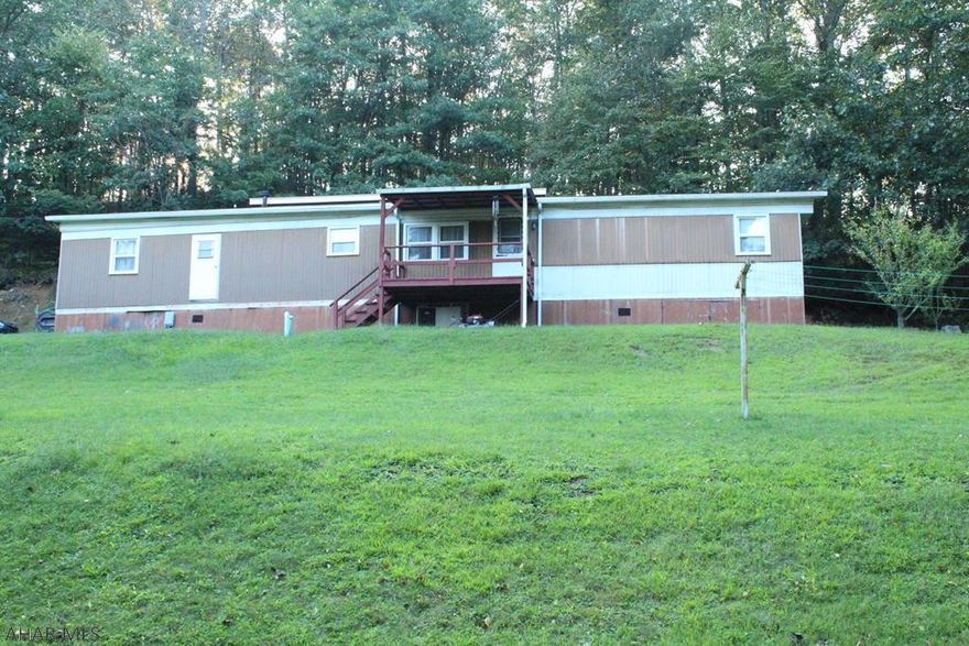 With some TLC this could be a nice weekend getaway or a full-time residence. One acre lot with privacy behind the home.