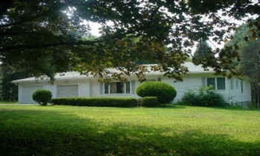 Super rancher - much larger that it looks!  Modern kitchen with breakfast bar and appliances.  Large master suite.  Two fireplaces - finished basement.  Rear deck and stone patio overlook nice private lot - almost an acre!