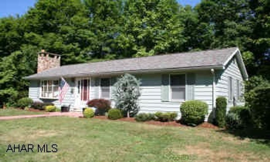 Vinyl shuttered Ranch Home on 1.741 acres with stream, enhanced by woodland; big bountiful yard w/large pine, magnolia & fruit trees. Beautiful woodland views. Enjoy the tranquil setting; walk down the path to the stream or take the stepping stones to the landscaped pond and waterfall. Listen to the water! ALSO white fencing w/circular drive.