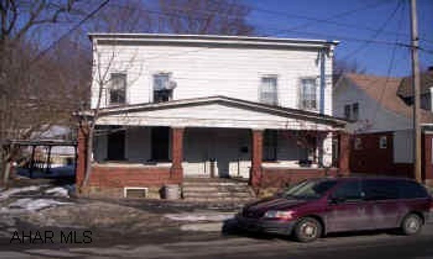 Side by side duplex, fixer upper. "SOLD AS IS"