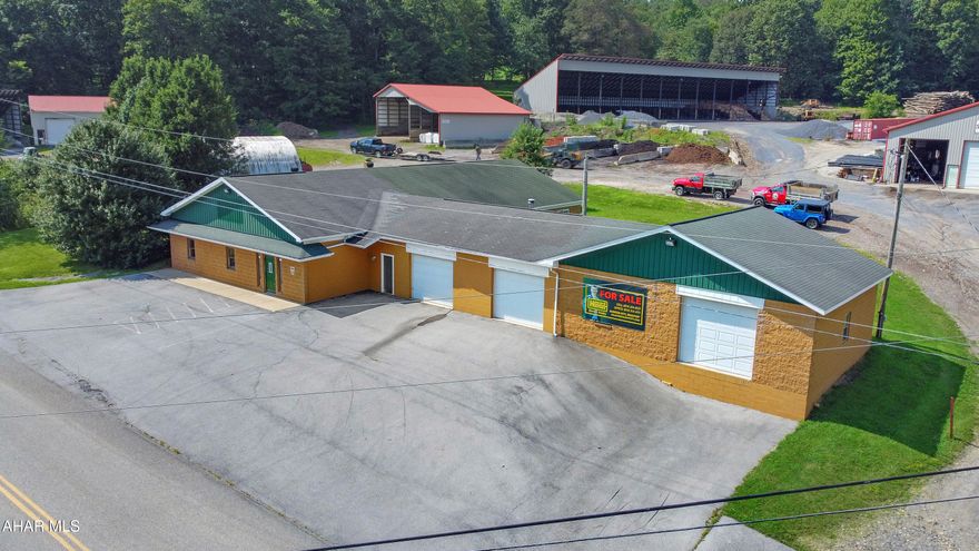 Discover an exceptional investment opportunity w/ this expansive 5,500+ square foot solid block building, featuring durable concrete floors & outstanding visibility from Route 22. This versatile property offers 1,200 square feet of prime retail space that can be tailored to suit any business need, along w/ an additional substantial area designated for garage & warehouse use. Designed for functionality, the building includes three overhead doors. One serving as a convenient loading dock, making it ideal for logistics & ease of access. The property is fully prepared for immediate occupancy for your new business venture. With limitless potential, this space can adapt to countless possibilities, making it a savvy choice for any entrepreneur. Don't miss out on this incredible opportunity—call today for more details!