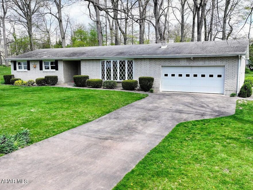 Take a look at this brick ranch style home beautifully situated on a lot at the end of Oak Lane in the Pennwood Development. The additional lot with a detached one-car garage, across the way, allows for no through traffic and a bit of privacy. Located just minutes to shopping and the hospital, yet the expansive yard area, rear patio with views of the picturesque fields of a neighboring farm, and mature trees add up to a relaxing country feel. Enjoy the added benefits of the central vacuum system, large attached garage and the heated driveway. This lovely home has recently been updated with a fresh coat of paint, new flooring throughout most of the home and is now ready for its new owners. Offering As is/Where is. Call to schedule your tour.